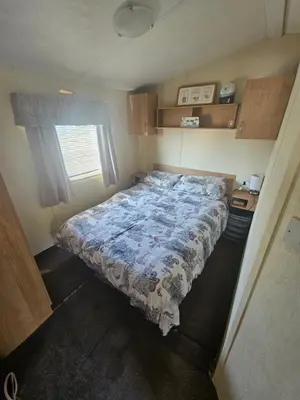 a bedroom with a large bed in a room at Number34 in Drummore