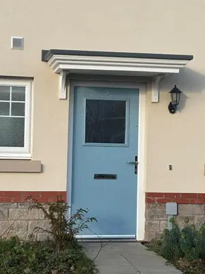 a blue door on a house with a window at 3,Lime Tree Ave in Moffat