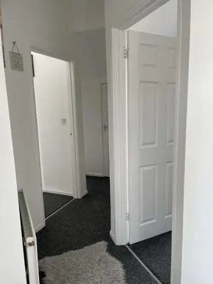 an empty room with a white door and a mirror at Brisco Terrace-sleeps 6 in Woodend