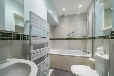 a bathroom with a sink and a tub and a toilet at Ben Place Cottage - Grasmere in Grasmere
