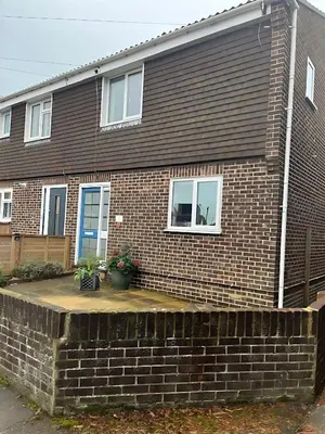 a brick house with a brick retaining wall at Deal - The place to stay in Moffat