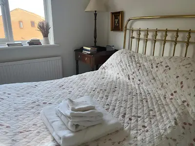 a bedroom with a bed with towels on it at Deal - The place to stay in Moffat