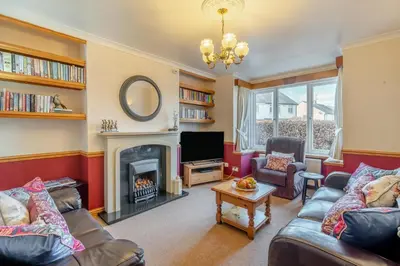 a living room with a fireplace and a tv at 3 Bed in Portinscale oc-w31059 in Portinscale