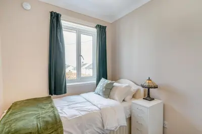 a bedroom with a bed and a window at 3 Bed in Portinscale oc-w31059 in Portinscale