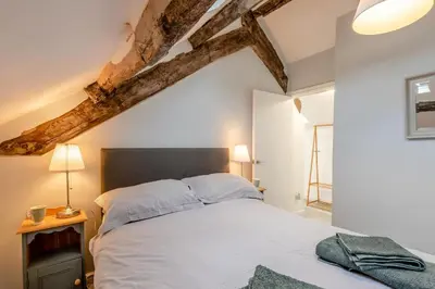 a bedroom with a white bed and a wooden ceiling at 2 Bed in Dean oc-h32066 in Dean