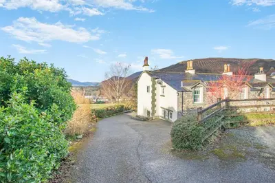 an old house with a driveway in front of it at 5 Bed in Keswick oc-h33619 in Keswick