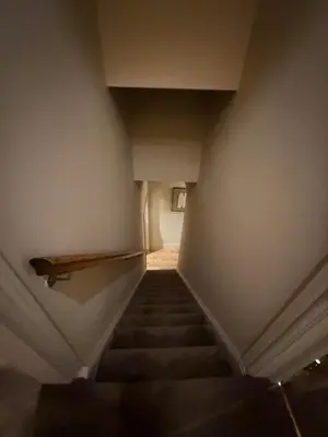 a flight of stairs in a building at Contractor 4BD Carlisle Long Stay w Wi-Fi, Washer, Smart TVs & Parking in Carlisle
