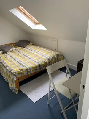 a bedroom with a bed and a chair in it at Crouch End in Moffat