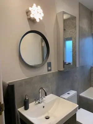 a bathroom with a sink and a mirror at Crouch End in Moffat