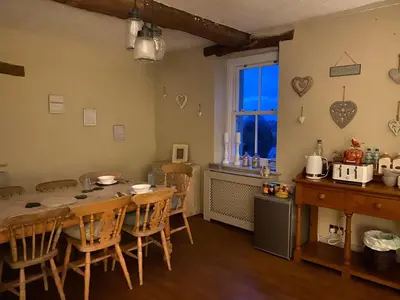a kitchen and dining room with a table and chairs at Highside farm in Embleton