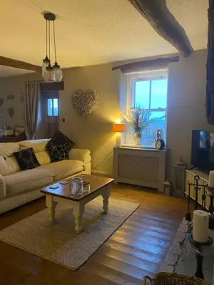 a living room with a couch and a coffee table at Highside farm in Embleton