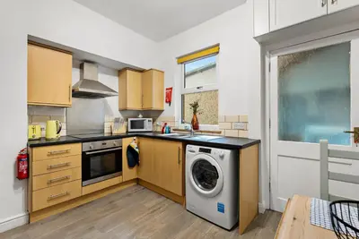 a kitchen with a washer and a washing machine at Vintage 2 Bed House in Lamplugh in Lamplugh