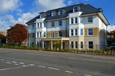 a large white house on the side of a street at The Palms in Moffat