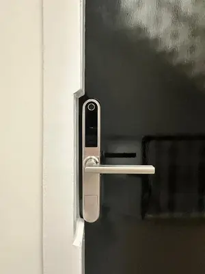 a white door with a handle on a door at The Penthouse - Beachwalk Apartments in Ayr