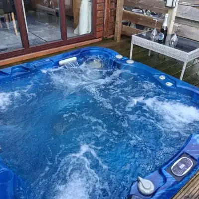 Redwood lodge with luxury hot tub at Three lochs holiday park
