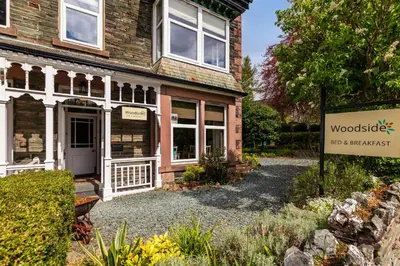 a house with a sign in front of it at Woodside B & B in Keswick