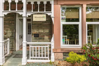 a house with a sign on the front door at Woodside B & B in Keswick