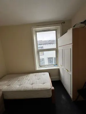a bedroom with a bed and a window at 9-11 London Road, Carlisle, CA12JU in Carlisle