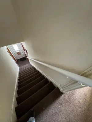an overhead view of a staircase in a room at 9-11 London Road, Carlisle, CA12JU in Carlisle