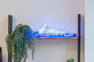 a sign for a team hanging on a wall at Central Jewellery Quarter 1-Bedroom with Parking in Moffat