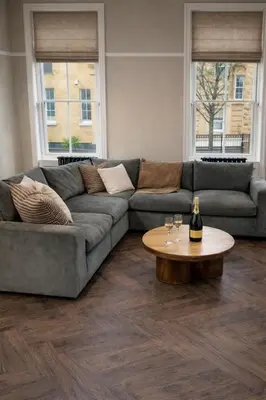 a living room with a couch and a table at Carlisle City Centre Fabulous Georgian townhouse in Carlisle