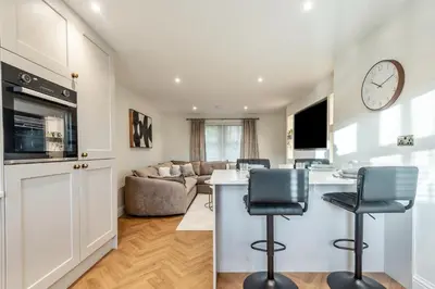 a kitchen and living room with a counter and chairs at 2 Bed in Gretna Green oc-n34146 in Gretna Green