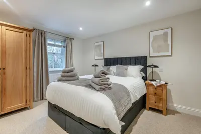 a bedroom with a bed with towels on it at 2 Bed in Gretna Green oc-n34146 in Gretna Green