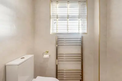 a bathroom with a toilet and a window at 2 Bed in Gretna Green oc-n34146 in Gretna Green