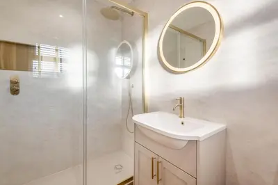 a bathroom with a shower and a sink and a mirror at 2 Bed in Gretna Green oc-n34146 in Gretna Green