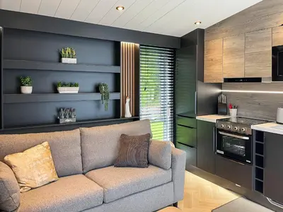a living room with a couch and a kitchen at Blencathra View - Uk50085 in Penruddock