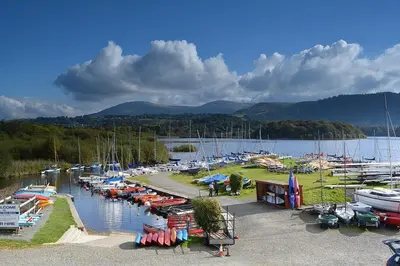 a bunch of boats are parked in a marina at Wordsworth Cottage in Keswick