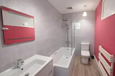 a bathroom with a white sink and a toilet at Riverside Heights- Dog Friendly Lakeland Retreat in Town Centre in Cockermouth