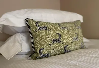 a pillow sitting on top of a bed at Catbells in Keswick