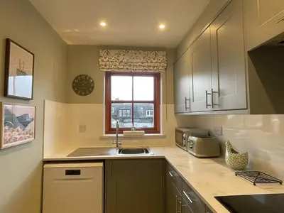 a kitchen with a sink and a window at Catbells in Keswick