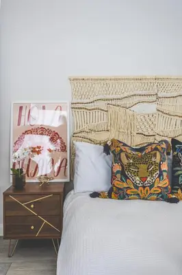 a bedroom with a bed and a wooden night stand at Luxury MArylebone Village family home in Moffat