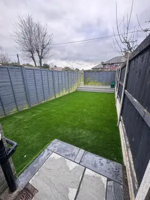a backyard with a fence and a green lawn at Granville Road, near Hospital, sleeps 5 in Carlisle
