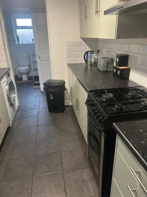 a kitchen with a stove and a counter top at Rochester Cosy Comfort near Shops and Restaurant in Moffat