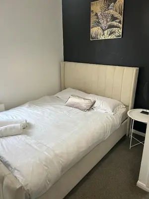 a bed with white sheets and a pillow on it at Rochester Cosy Comfort near Shops and Restaurant in Moffat