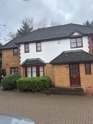 a white and red house with a brick at Peace Haven Hendon London NW4 in Moffat