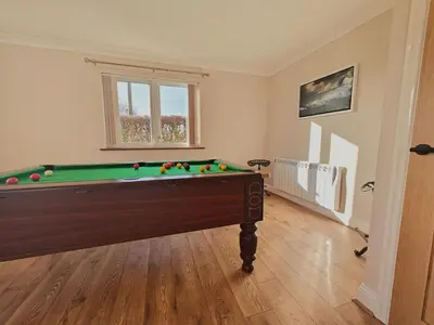 a living room with a pool table in it at 4 Bed in Ireby oc-p34997 in Ireby