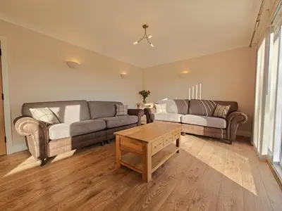a living room with two couches and a coffee table at 4 Bed in Ireby oc-p34997 in Ireby
