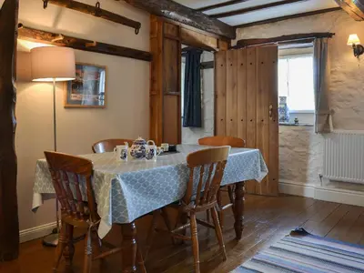 a dining room with a table and chairs at Branthwaite Stable in Caldbeck