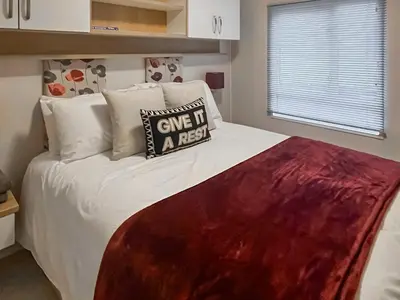 a bedroom with a bed with a pillow on it at The View in Stranraer