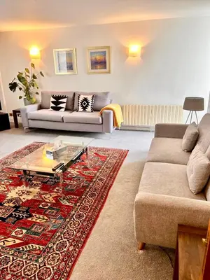 a living room with a couch and a coffee table at Mayfair Piccadilly Apartemnt - 3 in Moffat