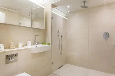 a bathroom with a shower and a sink at Luxury 2BR Park Lane Apartment Mayfair Sleeps 6 PL15B in Moffat