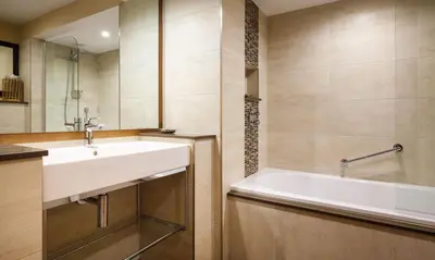 a bathroom with a sink and a bath tub at Underscar - Scafell in Applethwaite