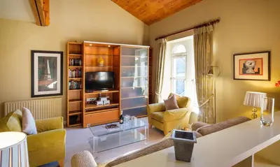 a living room filled with furniture and a tv at Underscar - Hindscarth in Applethwaite