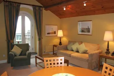 a living room with a couch and a table at Catbells in Applethwaite
