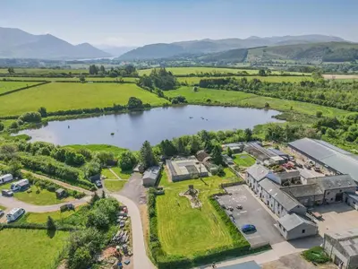 an aerial view of a resort with a lake at 1 Bed in Isel oc-b32075 in Sunderland