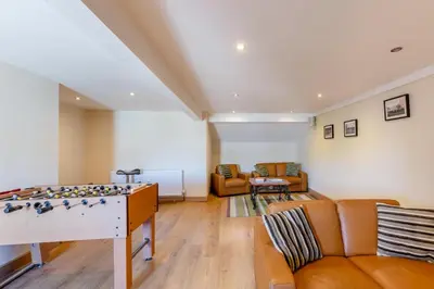 a living room with a foosball table and a couch at 1 Bed in Isel oc-b32075 in Sunderland